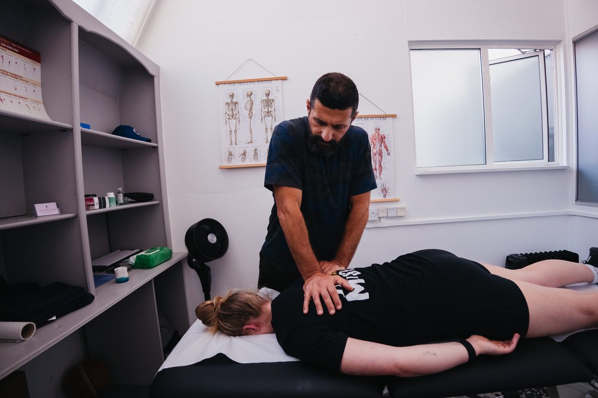 Anthony Vidis treating a client in the clinic